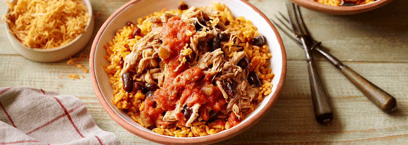 slow cooker burrito bowl served on wooden table