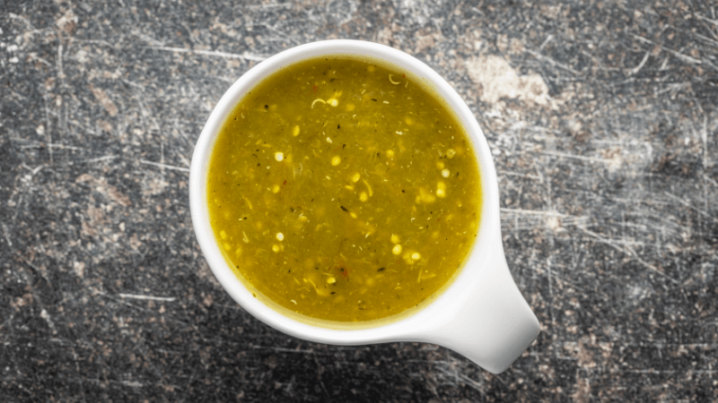 green jalapeno sauce in white cup