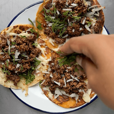 delicious street vibes tacos served on a white plate