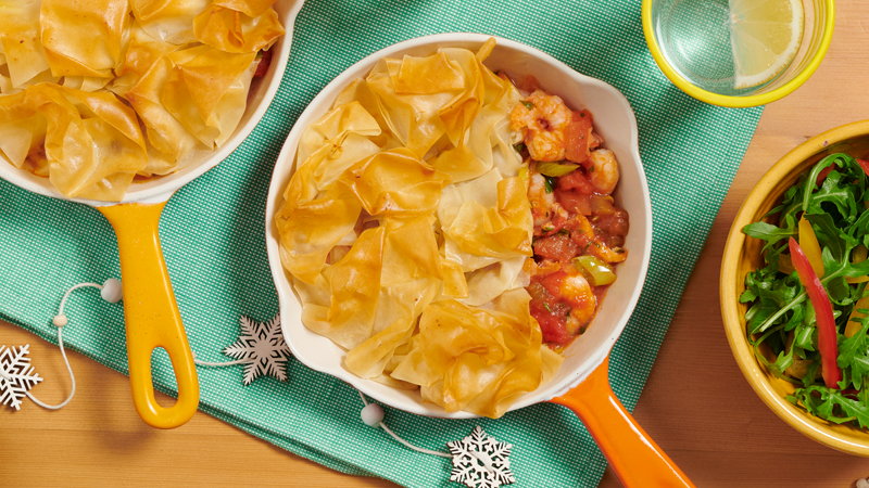 Salsa Seafood Filo Pies served in a pan on green cloth placed on table